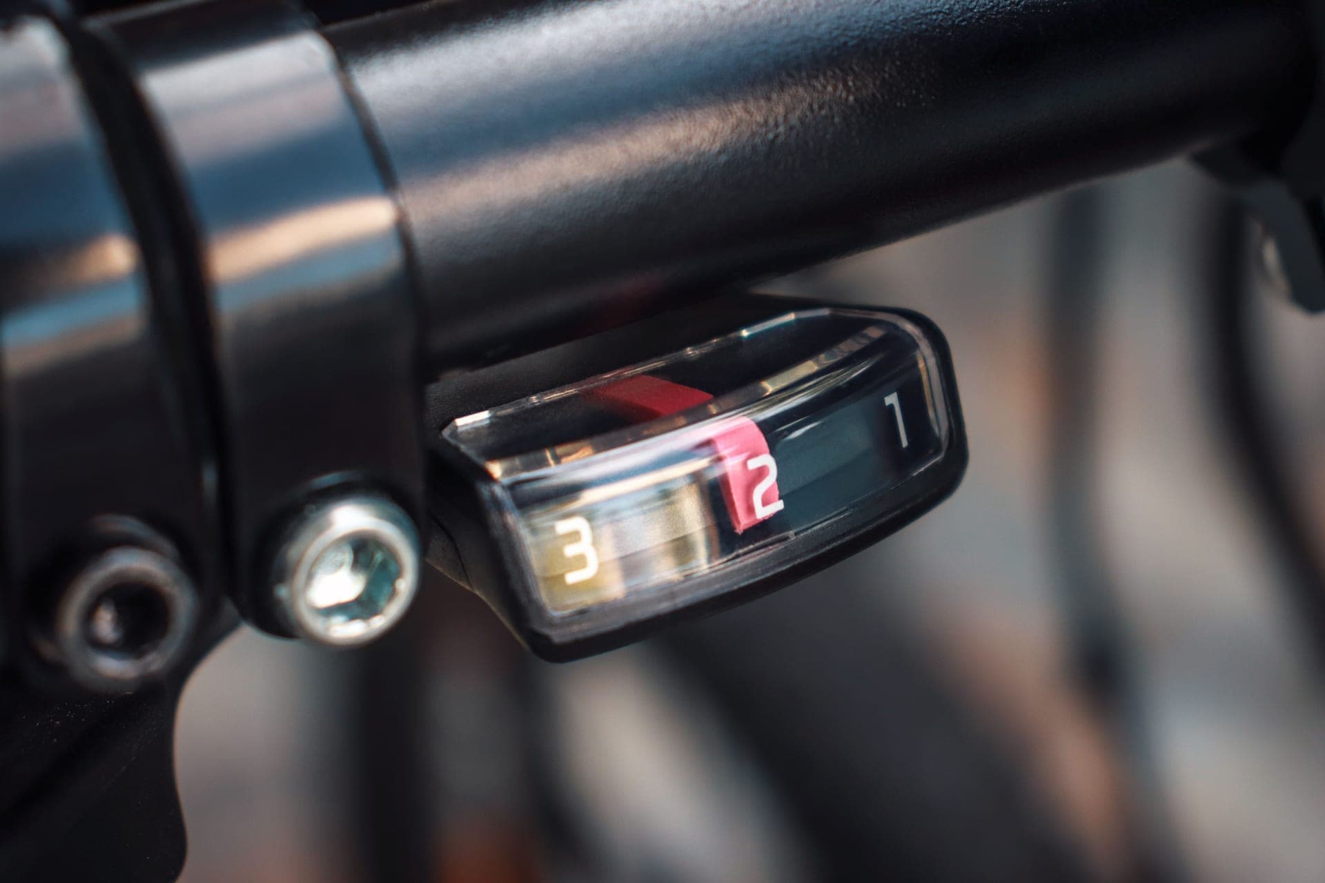 Detail of a SRAM AXS road rear derailleur and cassette on a bicycle.