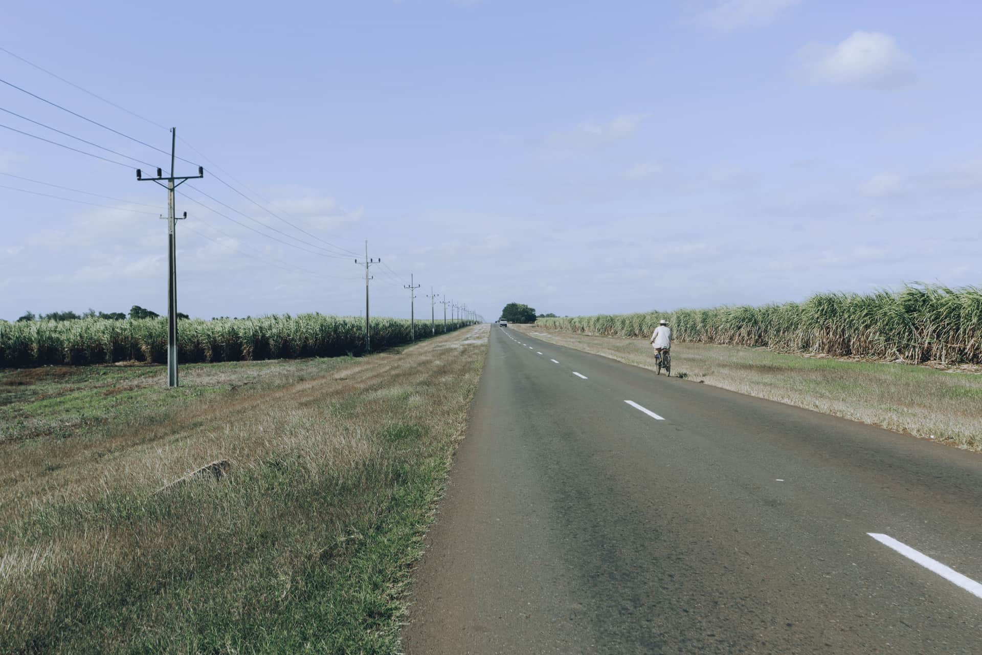 An electric bike on an empty road stretching into the distance.