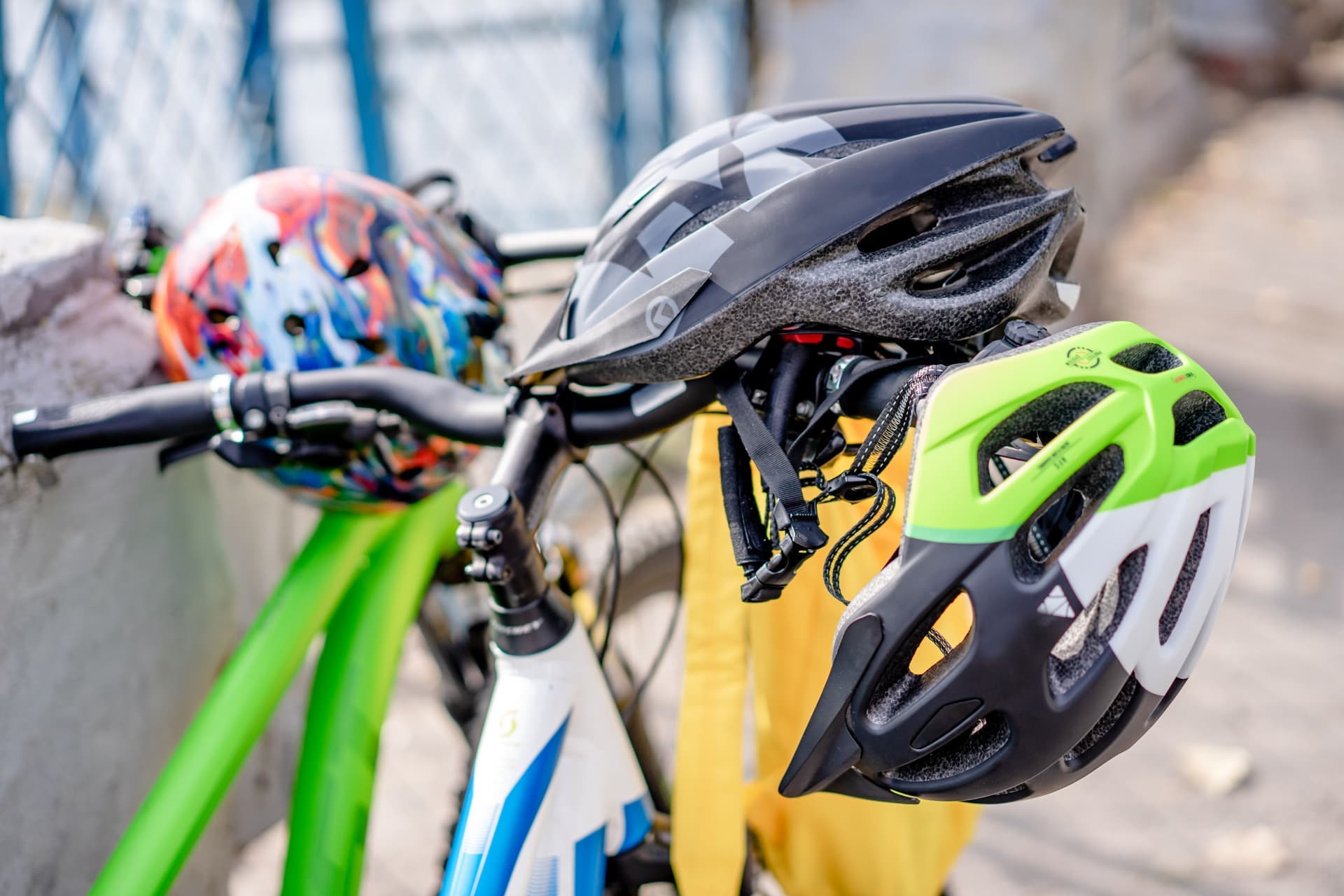 A cycling helmet's inner foam liner and retention cradle photographed on a bench.