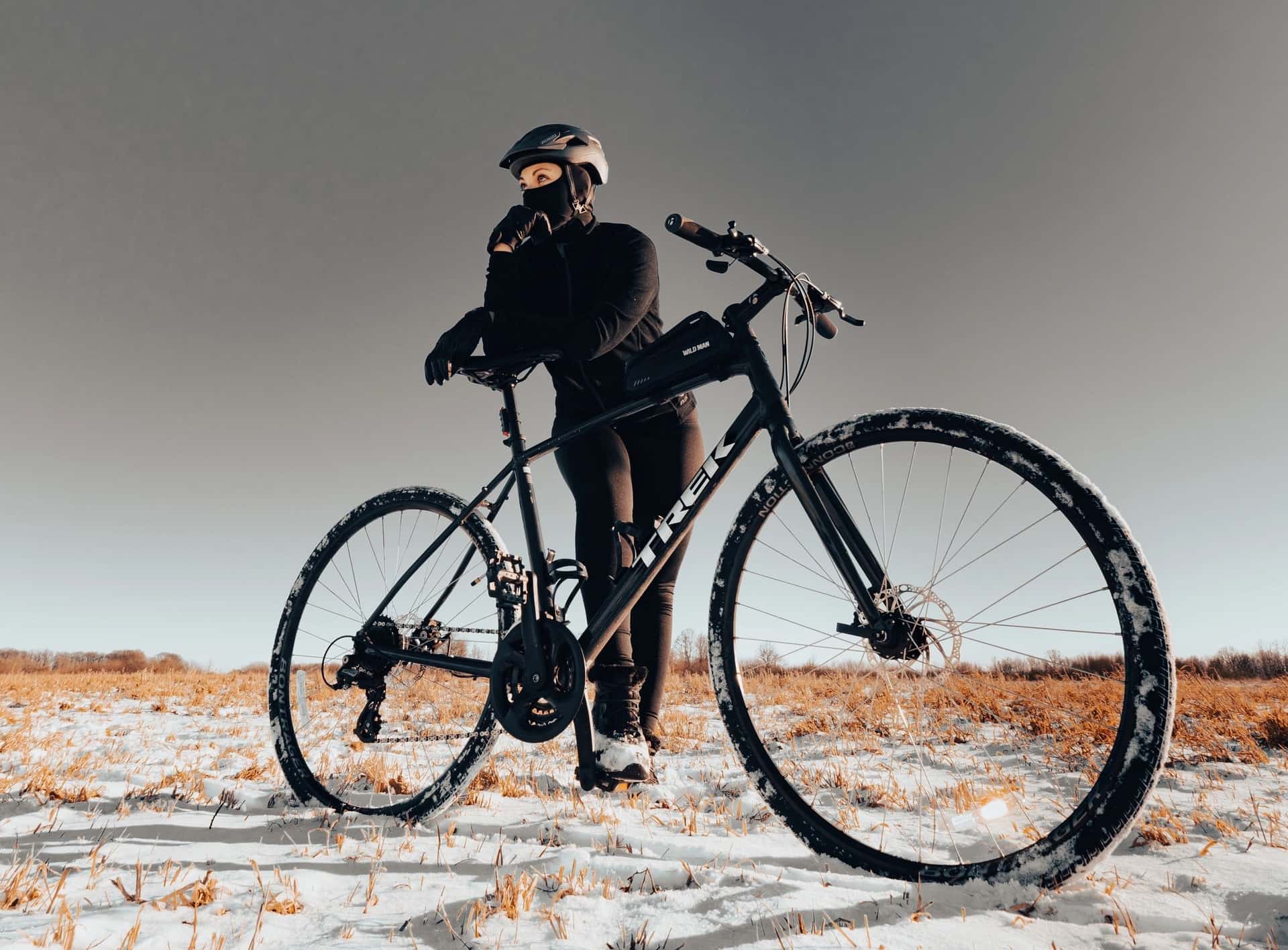 Cold-weather cycling layers laid out on a bench — base layer, thermal jersey and shell.