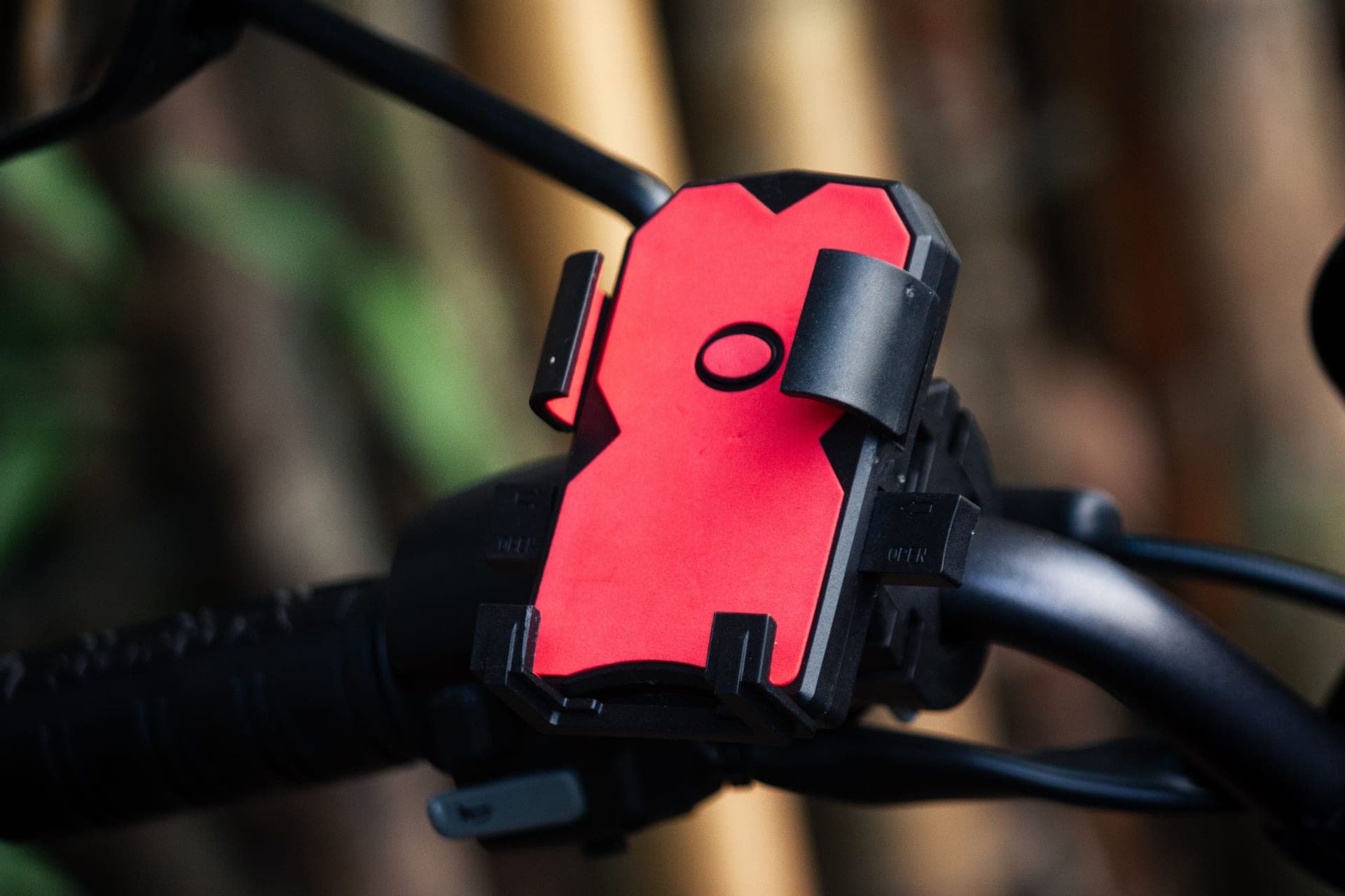 A smartphone mounted on a bicycle handlebar showing a route map.