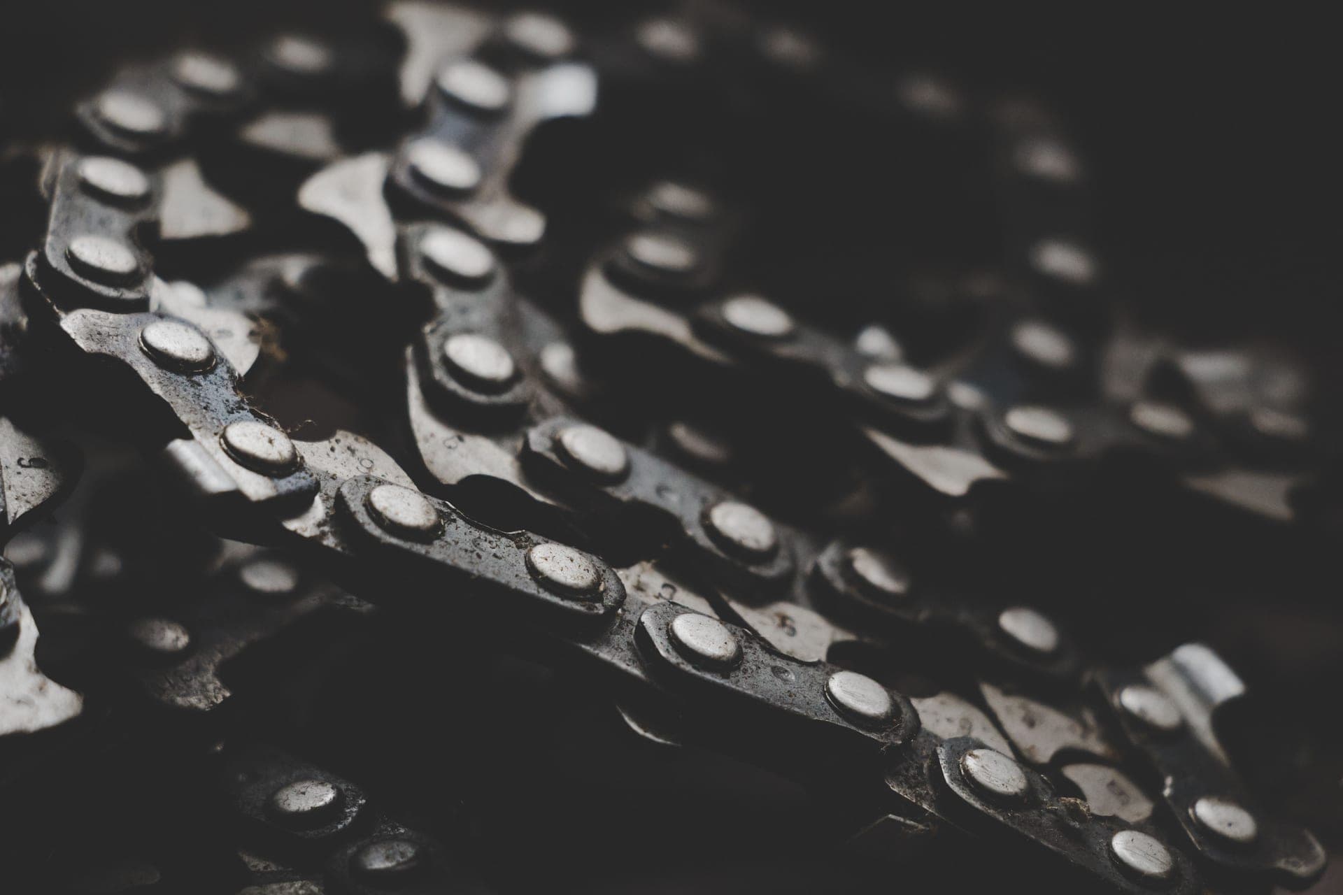 Bicycle chains photographed close up in monochrome.